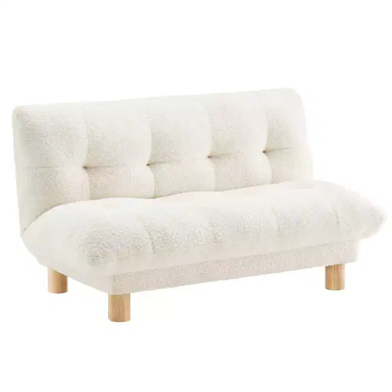 Canapé pour enfants rembourré en fausse fourrure d'agneau Buzz & Bloom avec assise et dossier capitonnés, pieds en bois, coloris marshmallow
