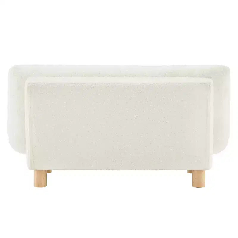 Canapé pour enfants rembourré en fausse fourrure d'agneau Buzz & Bloom avec assise et dossier capitonnés, pieds en bois, coloris marshmallow