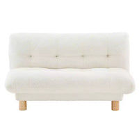 Canapé pour enfants rembourré en fausse fourrure d'agneau Buzz & Bloom avec assise et dossier capitonnés, pieds en bois, coloris marshmallow