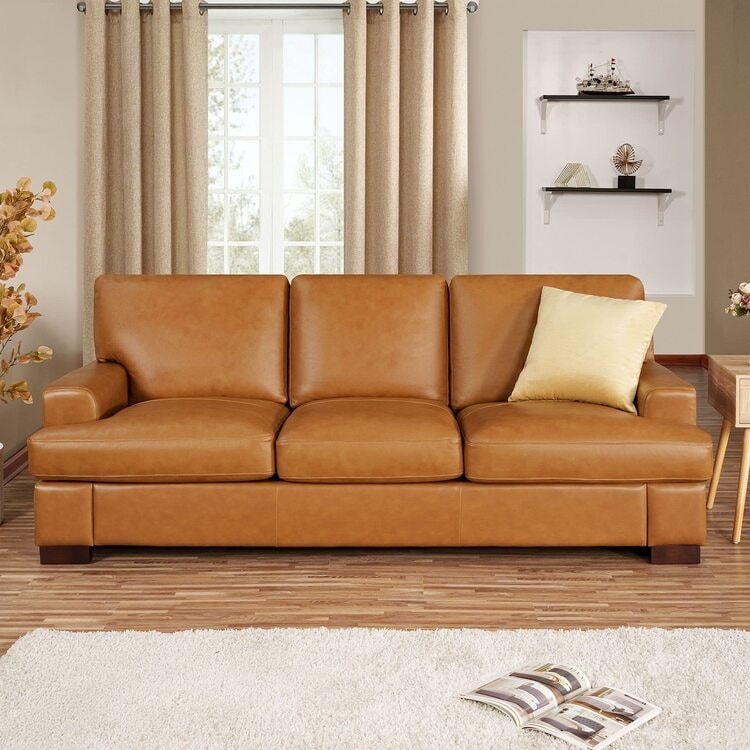 Canapé moderne en cuir véritable avec pieds en bois & coussin traversin supplémentaire